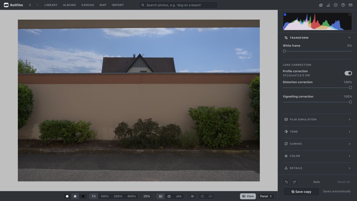 The editor's lens correction: profile correction switched on for the lens the photo was taken with, with distortion and vignetting sliders.