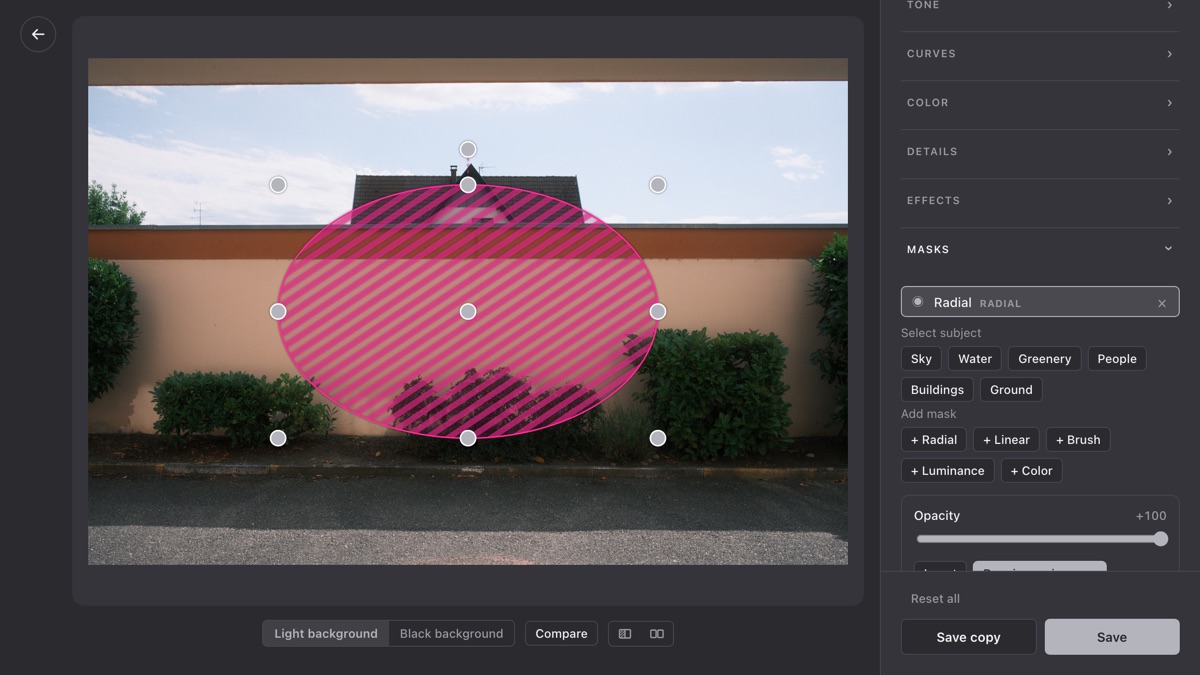 The editor with a mask over the sky and the local adjustment sliders beside it.